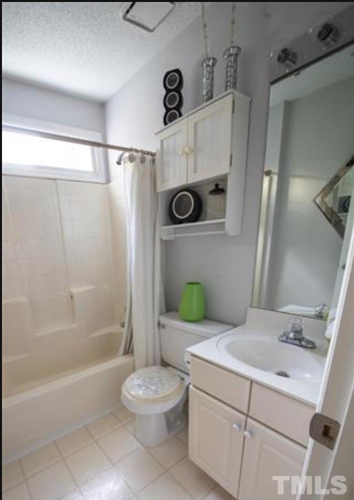 7613 Overland Trail Raleigh, NC 27615 - Photo 13 of 22 a bathroom with a granite countertop bathtub sink vanity mirror and toilet