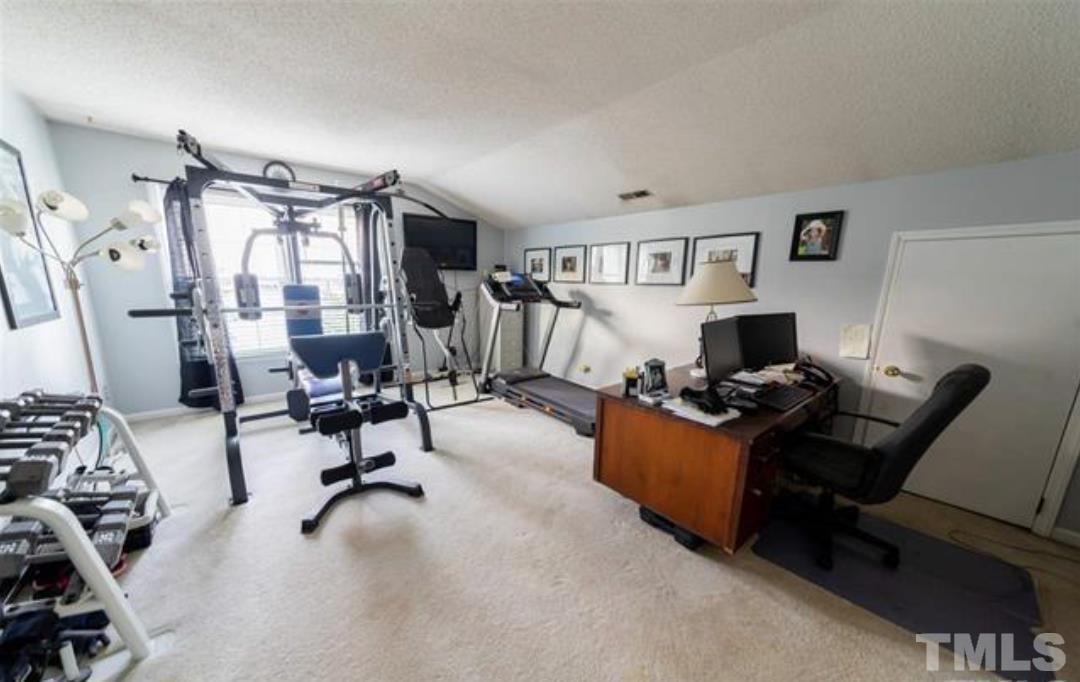 7613 Overland Trail Raleigh, NC 27615 - Photo 14 of 22 a view of a livingroom with workspace and a window