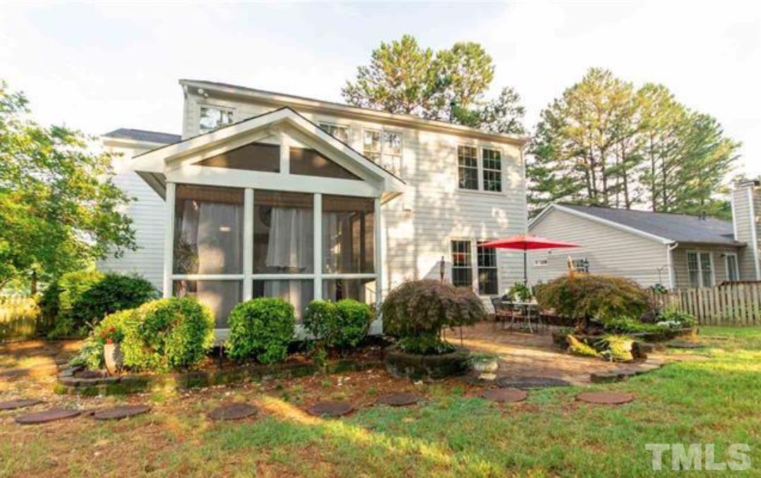 7613 Overland Trail Raleigh, NC 27615 - Photo 20 of 22 a view of a house with a yard and plants