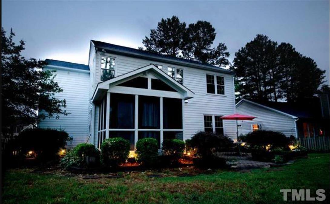 7613 Overland Trail Raleigh, NC 27615 - Photo 22 of 22 a front view of a house with a garden