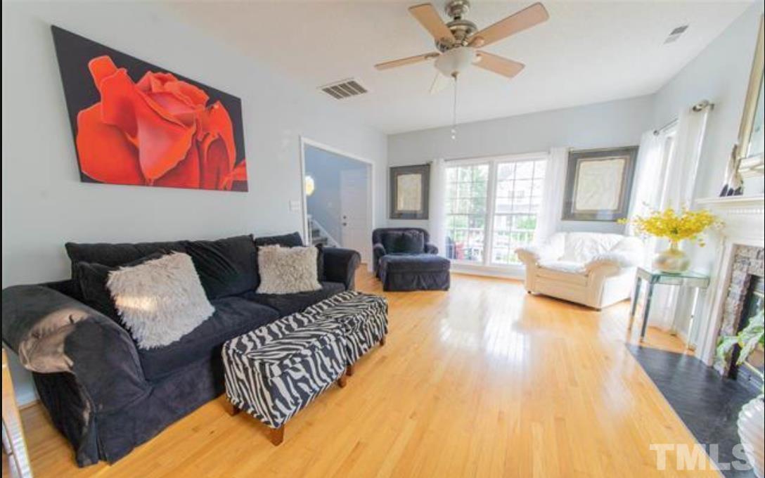 7613 Overland Trail Raleigh, NC 27615 - Photo 3 of 22 a living room with furniture and a fireplace