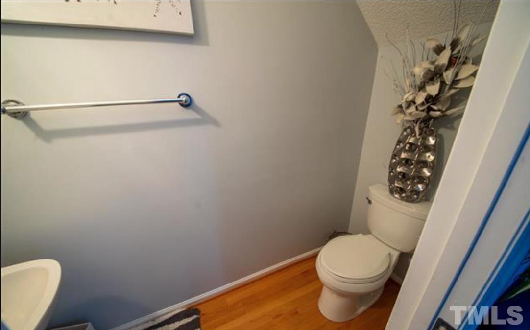 7613 Overland Trail Raleigh, NC 27615 - Photo 5 of 22 a white toilet sitting next to a shower