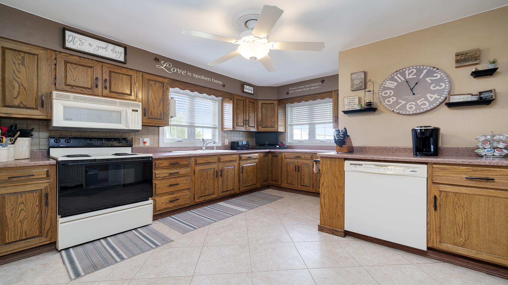 1018 Hoyle Road Harmon, IL 61042 - Photo 16 of 41 a kitchen with cabinets a window and stainless steel appliances