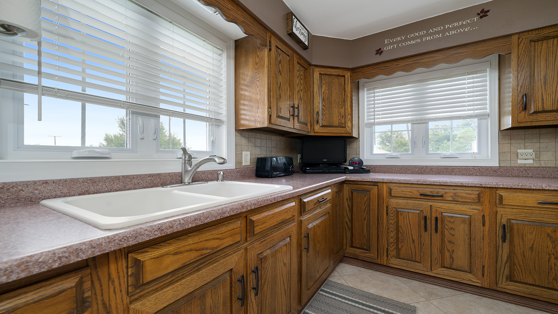 1018 Hoyle Road Harmon, IL 61042 - Photo 18 of 41 a kitchen with stainless steel appliances granite countertop a sink a stove cabinets and a window
