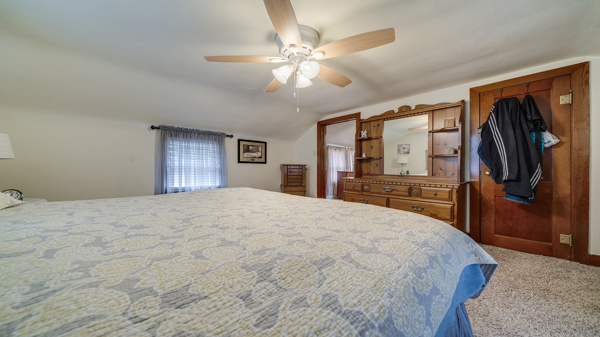 1018 Hoyle Road Harmon, IL 61042 - Photo 21 of 41 a bedroom with a large bed and a flat tv screen on dresser