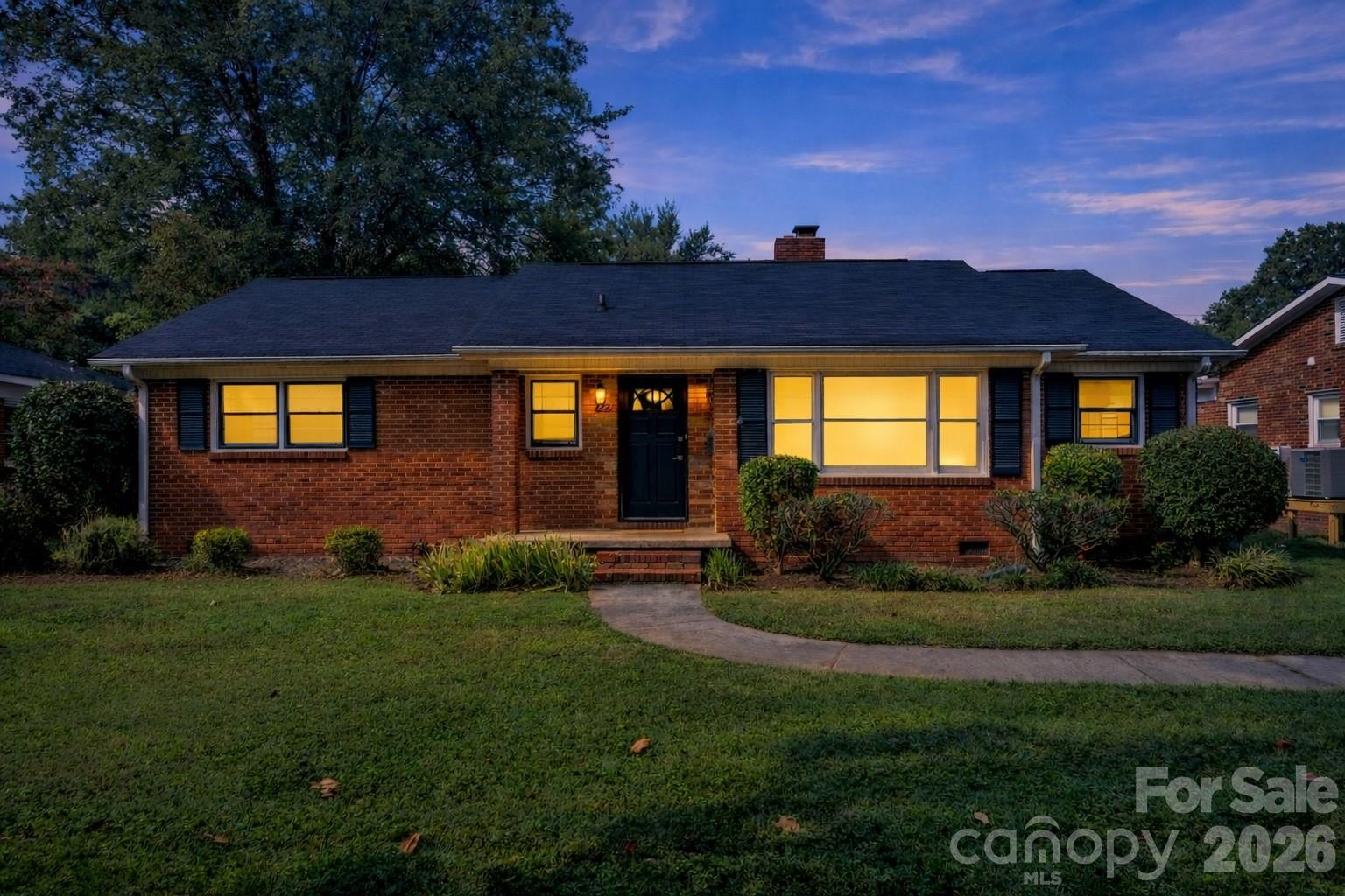 1227 Barkley Road Charlotte, NC 28209 - Photo 1 of 37 a front view of a house with a yard