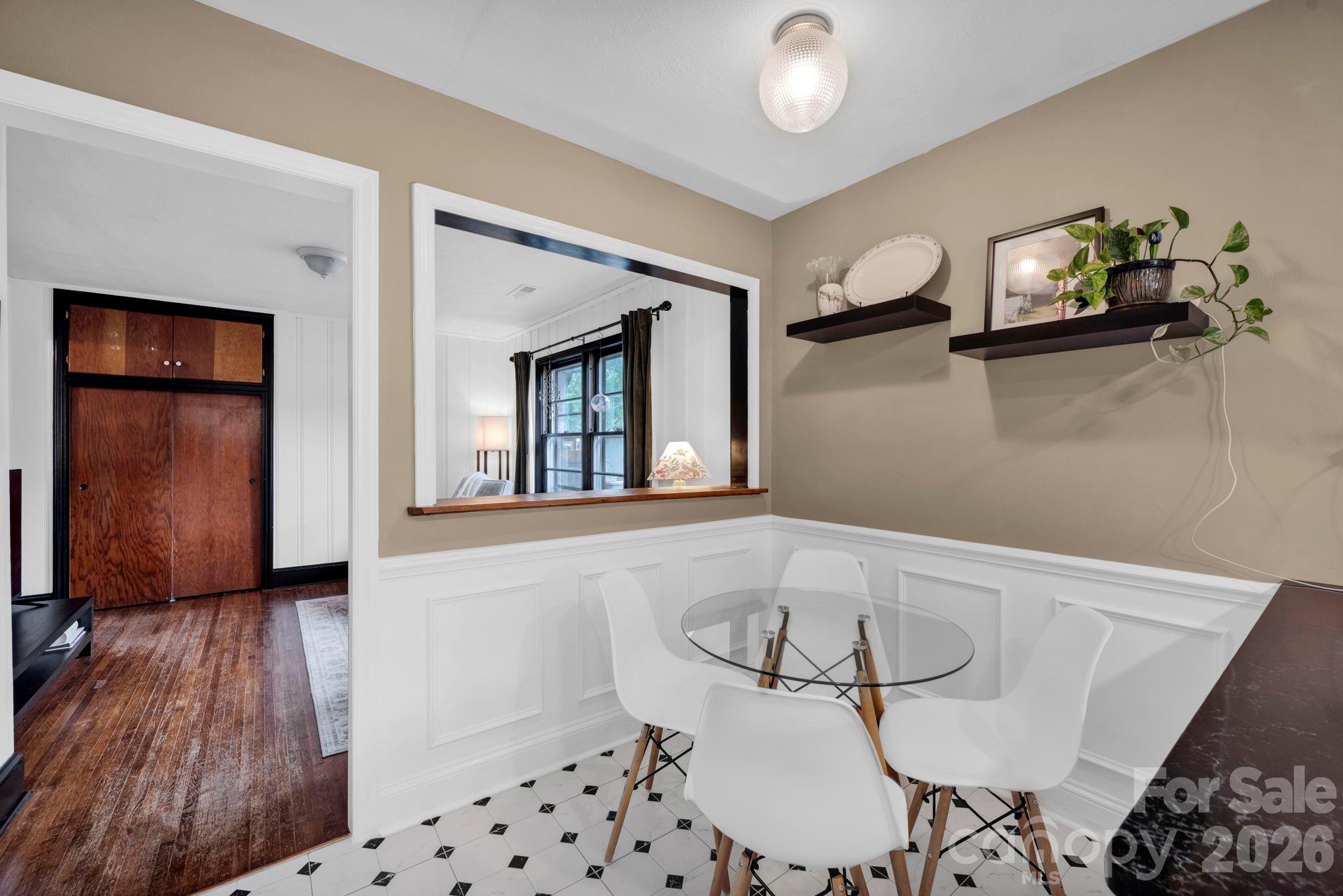 1227 Barkley Road Charlotte, NC 28209 - Photo 15 of 37 a view of a hallway with workspace and mirror