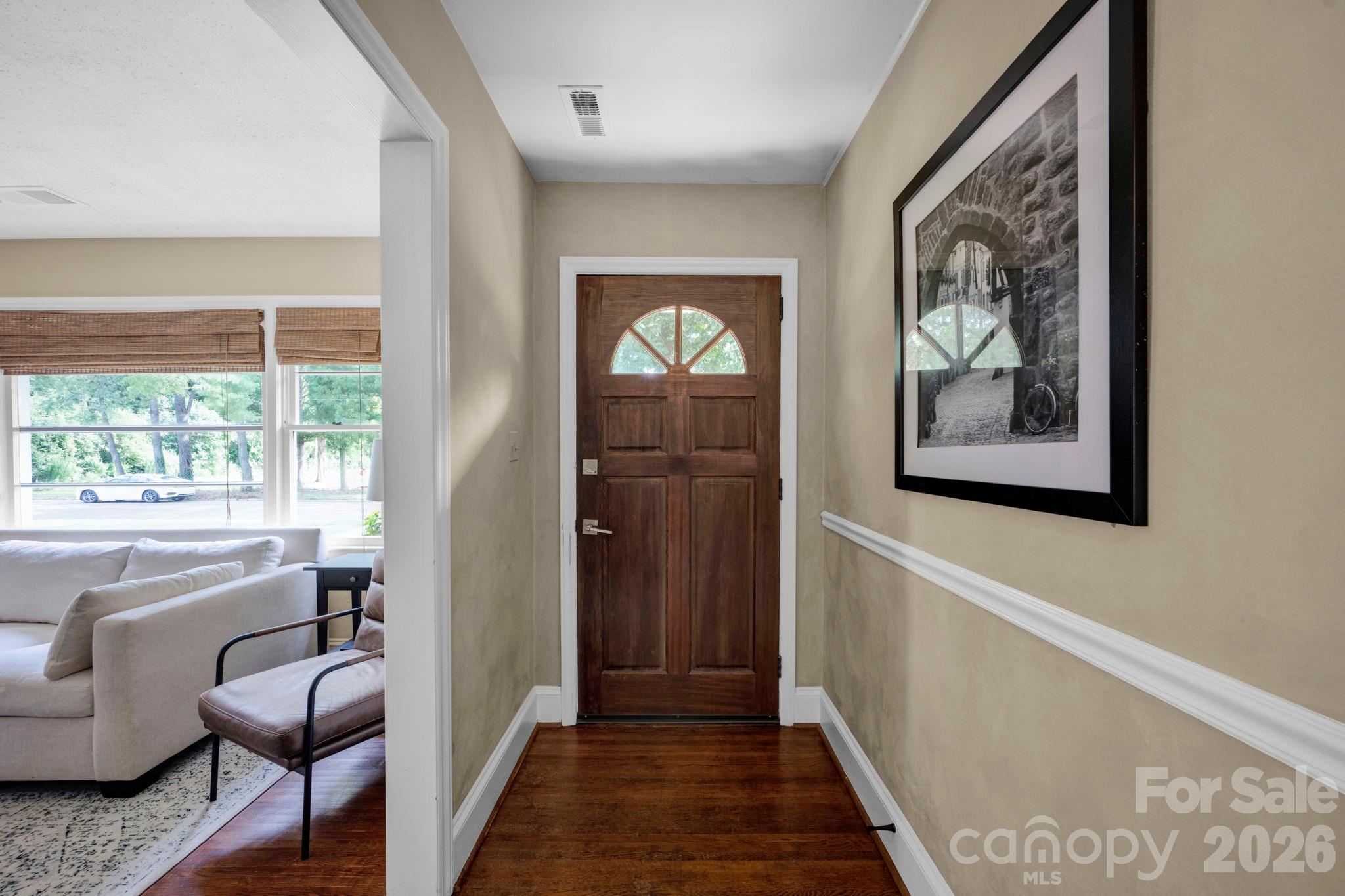1227 Barkley Road Charlotte, NC 28209 - Photo 2 of 37 a view of a hallway to a livingroom with furniture and windows