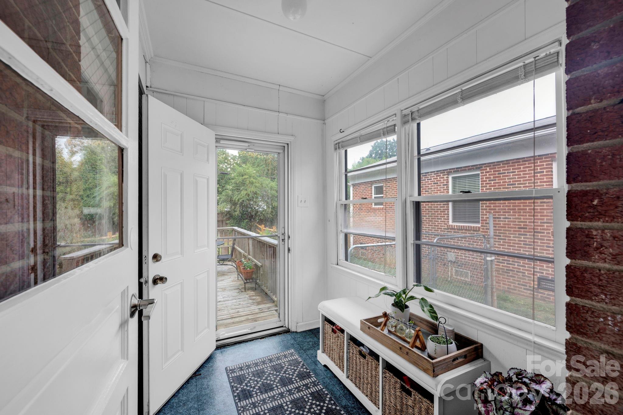 1227 Barkley Road Charlotte, NC 28209 - Photo 23 of 37 a living room with furniture and wooden floor