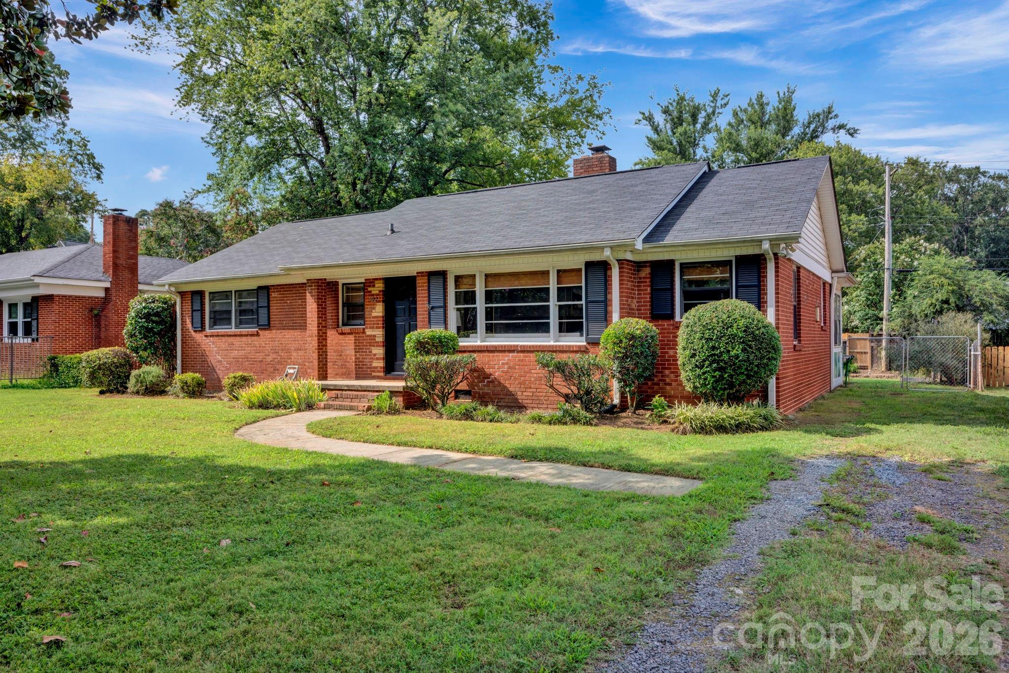1227 Barkley Road Charlotte, NC 28209 - Photo 36 of 37 a view of a house with a big yard plants and large trees