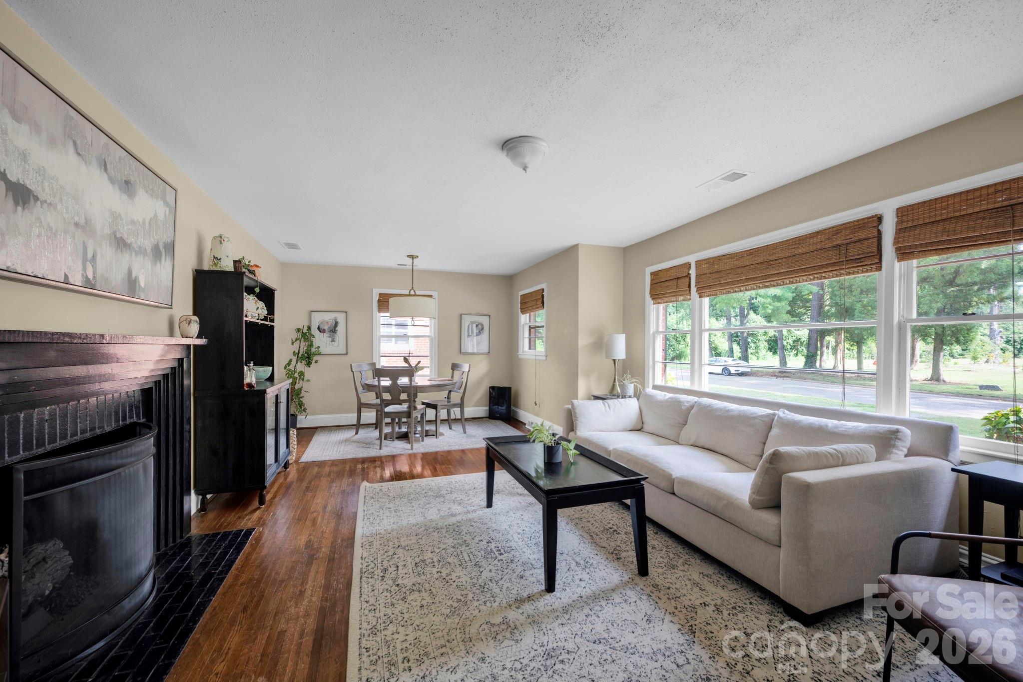 1227 Barkley Road Charlotte, NC 28209 - Photo 6 of 37 a living room with furniture and a fireplace