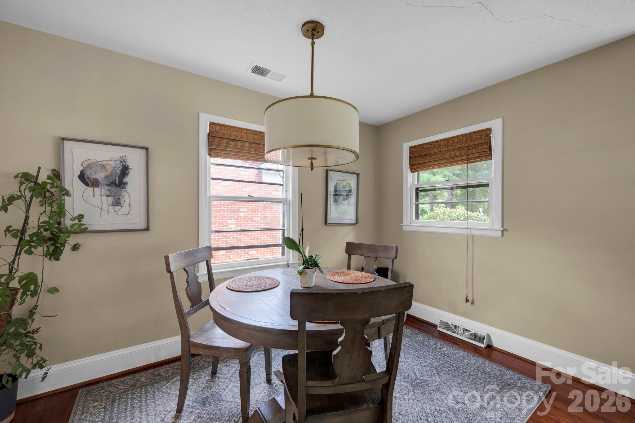 1227 Barkley Road Charlotte, NC 28209 - Photo 7 of 37 a view of a dining room with furniture window and wooden floor