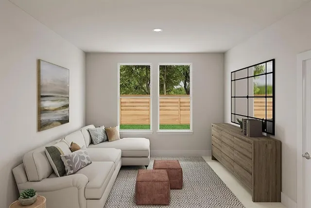 a living room with a table and a window