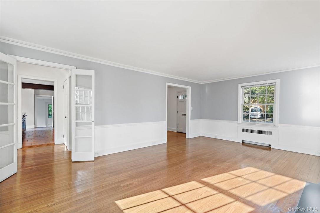 246 Mamaroneck Road Scarsdale, NY 10583 - Photo 5 of 35 Sun-filled living room with French doors and hardwood floors