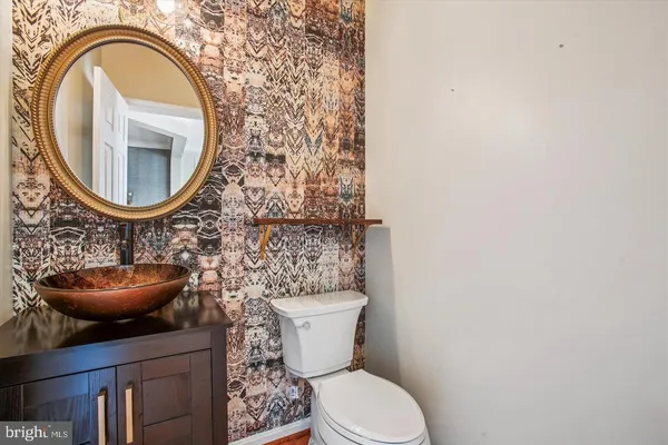 a bathroom with a toilet and a sink