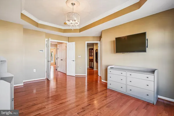 a view of livingroom with wooden floor and cabinet