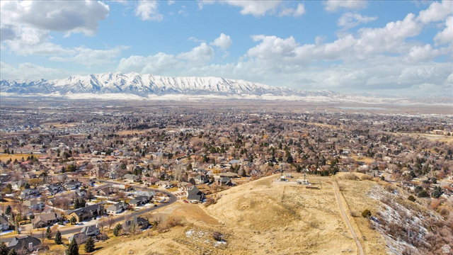 147 Winding Way, Unit 50 Logan, UT 84321 - Photo 13 of 16 Aerial perspective of suburban area featuring mountains