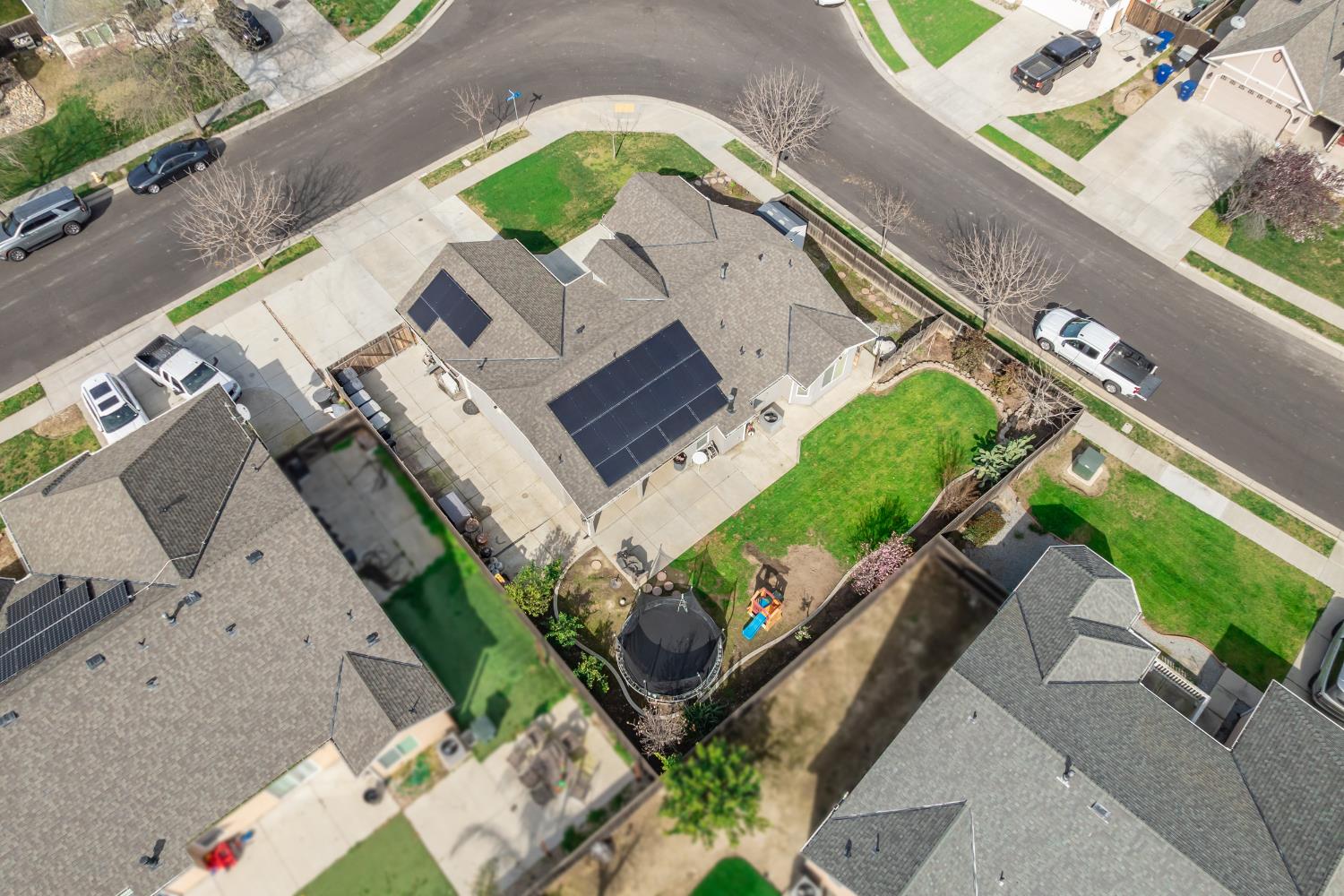 1116 Liberation Way Lemoore, CA 93245 - Photo 12 of 43 an aerial view of a house with a yard pool patio and outdoor seating