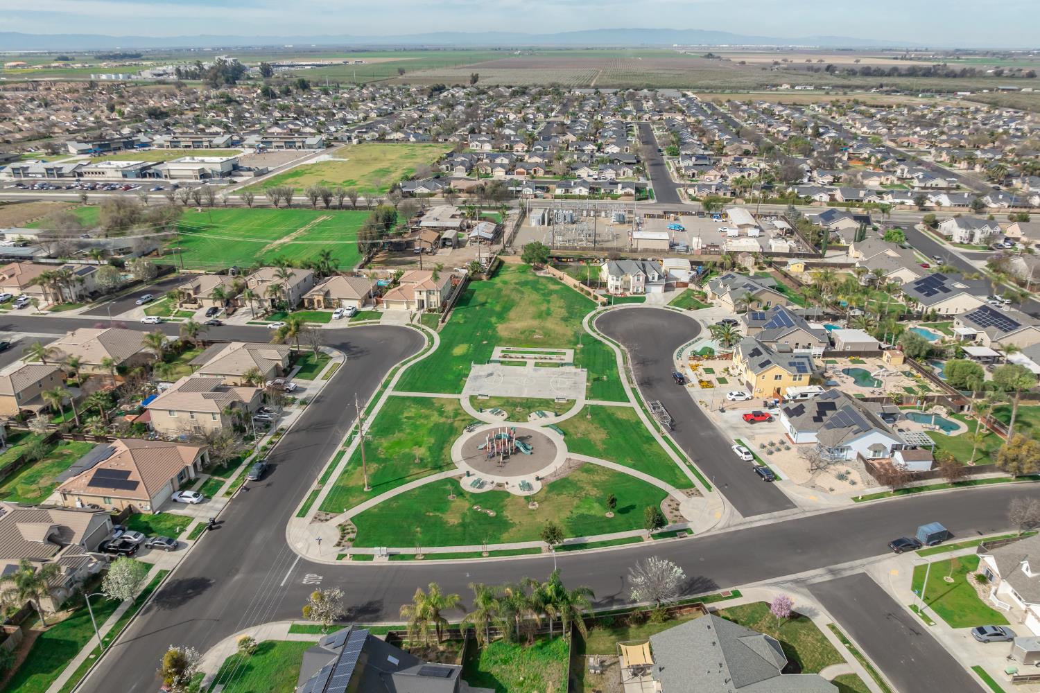 1116 Liberation Way Lemoore, CA 93245 - Photo 14 of 43 an aerial view of a residential houses with outdoor space