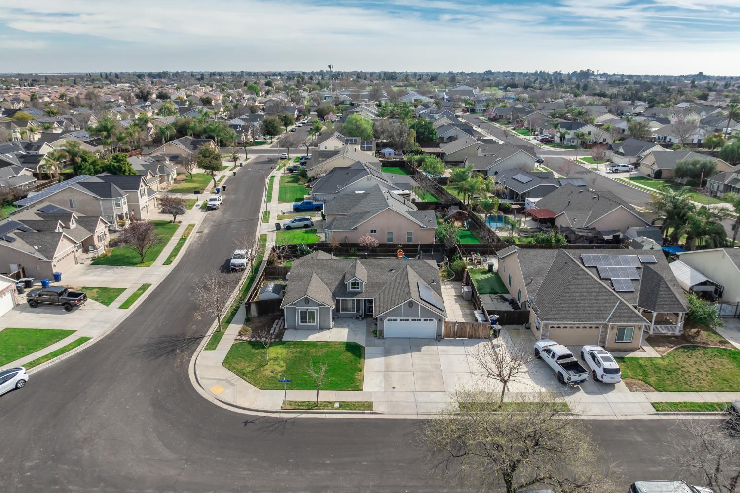 1116 Liberation Way Lemoore, CA 93245 - Photo 16 of 43 an aerial view of a house with a garden
