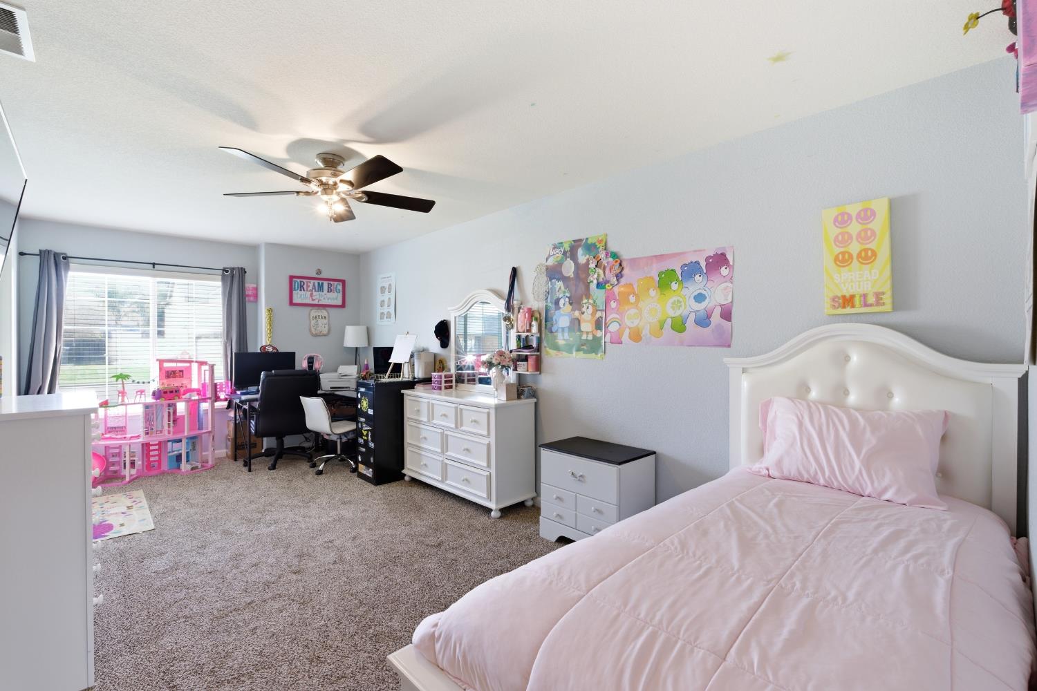 1116 Liberation Way Lemoore, CA 93245 - Photo 22 of 43 a bedroom with furniture and a chandelier