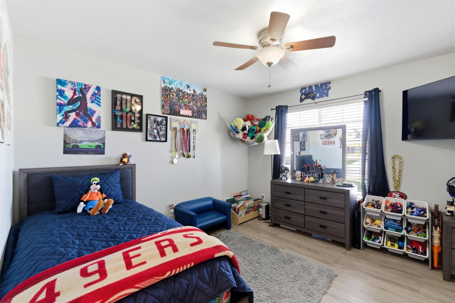 1116 Liberation Way Lemoore, CA 93245 - Photo 23 of 43 a bed room with furniture and a bed