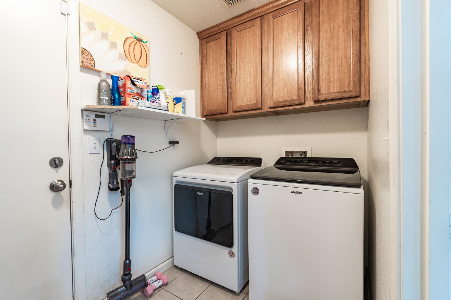 1116 Liberation Way Lemoore, CA 93245 - Photo 24 of 43 a utility room with dryer and washer