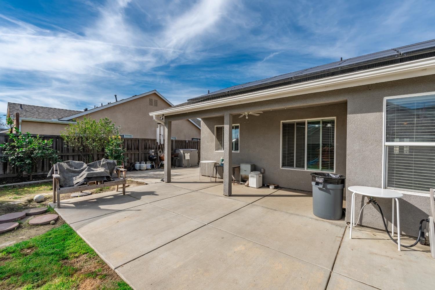 1116 Liberation Way Lemoore, CA 93245 - Photo 25 of 43 a view of a patio with table and chairs and potted plants