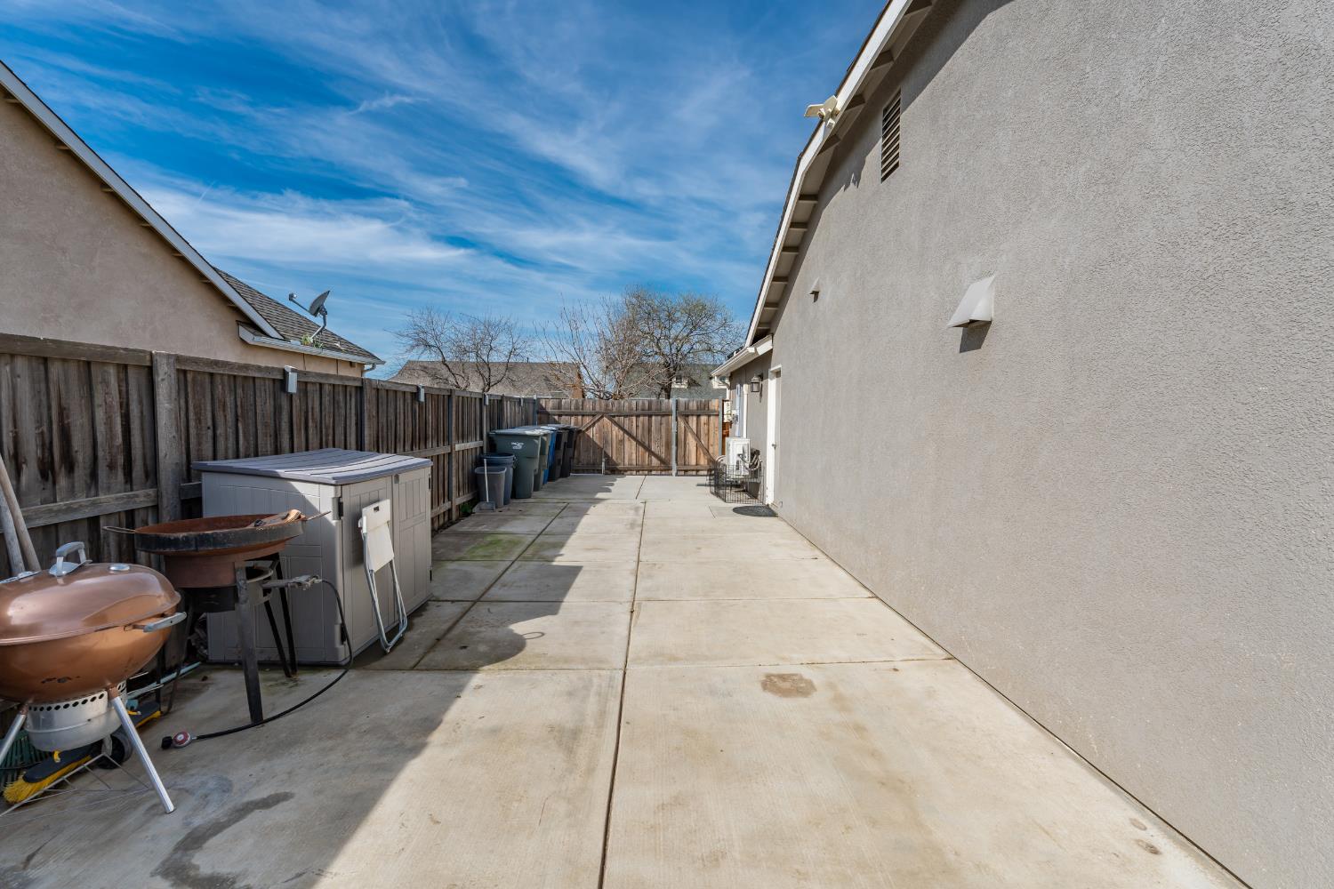 1116 Liberation Way Lemoore, CA 93245 - Photo 26 of 43 a view of balcony with chairs and wooden fence