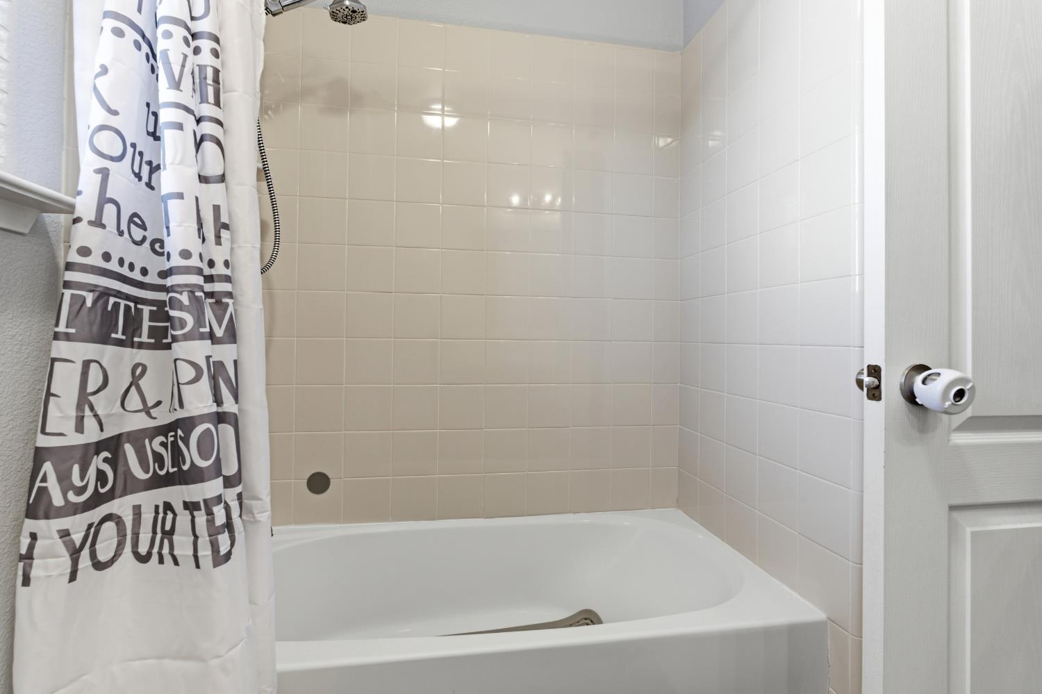 1116 Liberation Way Lemoore, CA 93245 - Photo 26 of 43 a bathroom with a bathtub and shower