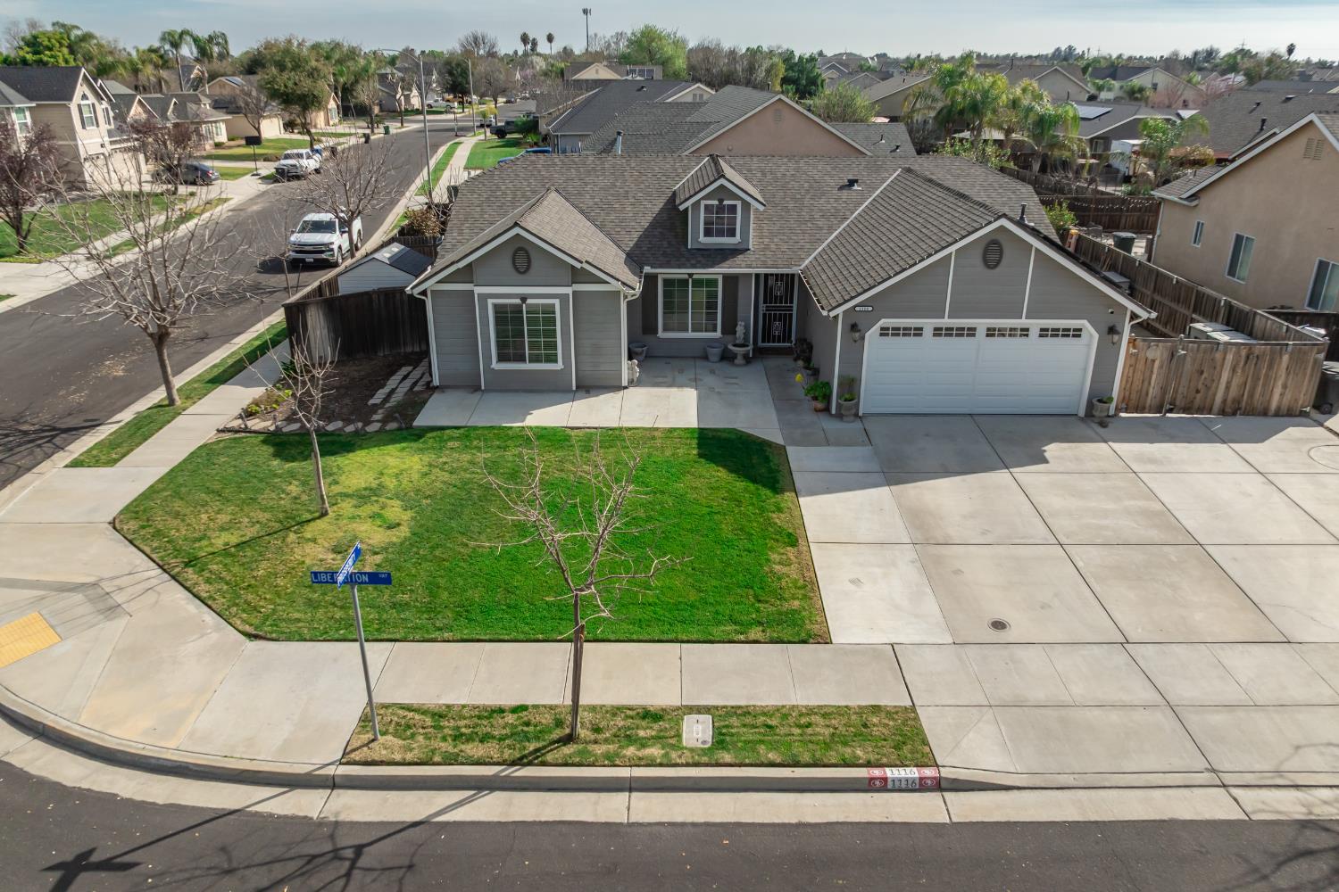 1116 Liberation Way Lemoore, CA 93245 - Photo 34 of 43 a view of house and garden