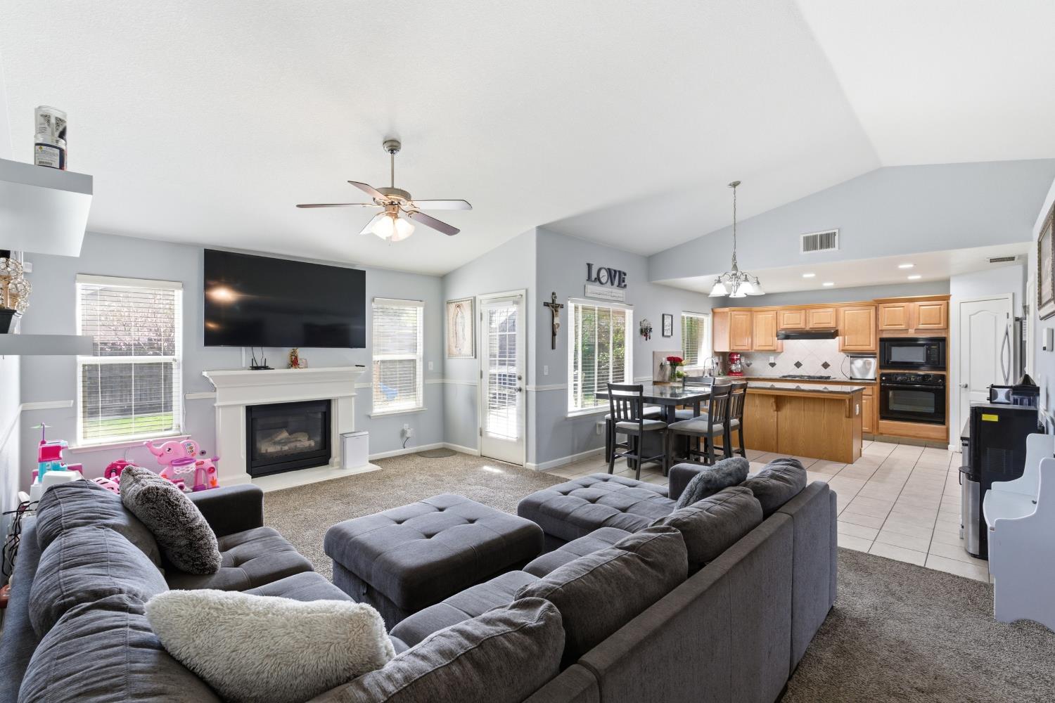 1116 Liberation Way Lemoore, CA 93245 - Photo 4 of 43 a living room with furniture fireplace and flat screen tv