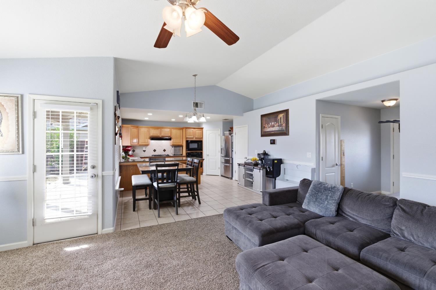 1116 Liberation Way Lemoore, CA 93245 - Photo 6 of 43 a living room with furniture and a large window