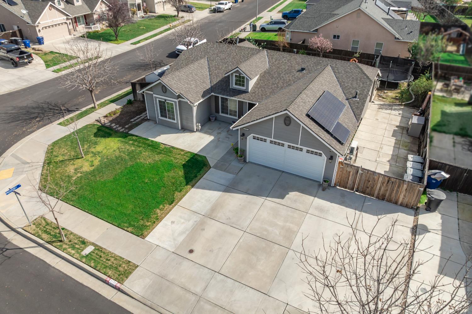 1116 Liberation Way Lemoore, CA 93245 - Photo 10 of 43 an aerial view of a house with a yard