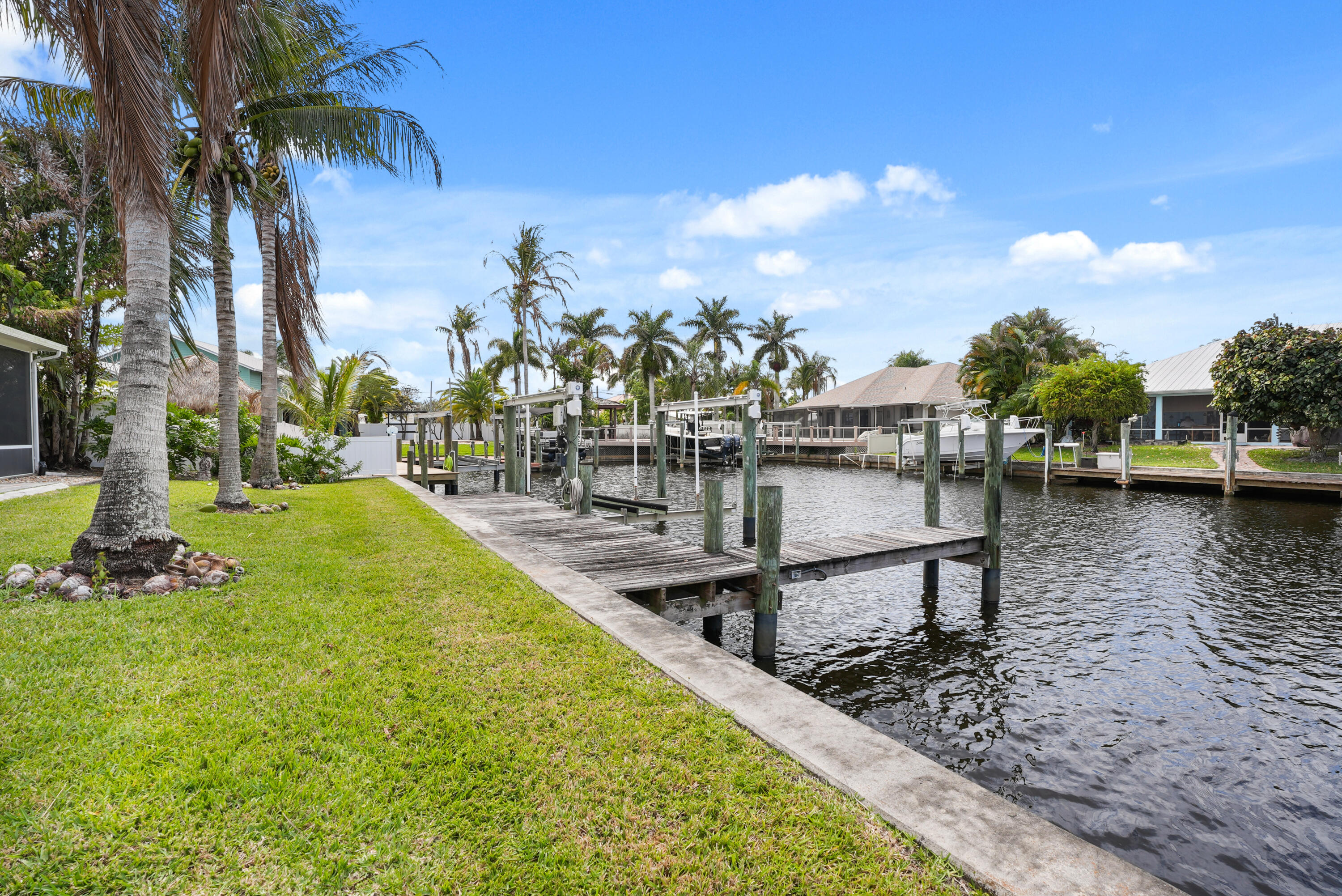 1459 Southwest Seahawk Way Palm City, FL 34990 - Photo 39 of 43 a view of a lake with a sitting area