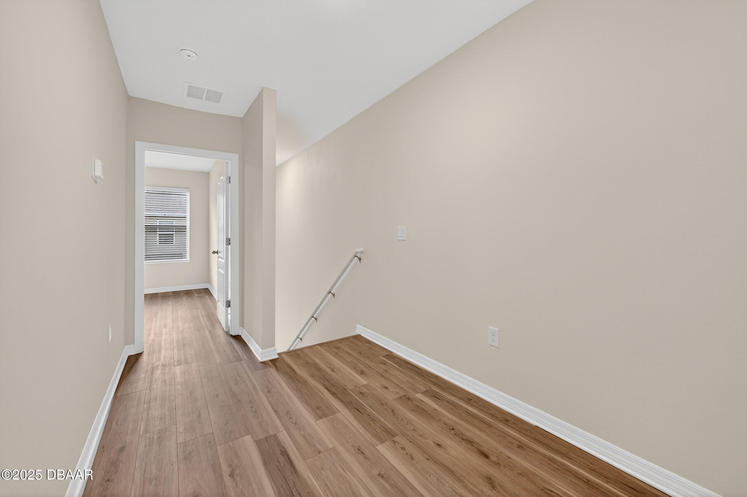 54 Bella Oaks Drive Port Orange, FL 32129 - Photo 14 of 32 a view of a room with wooden floor