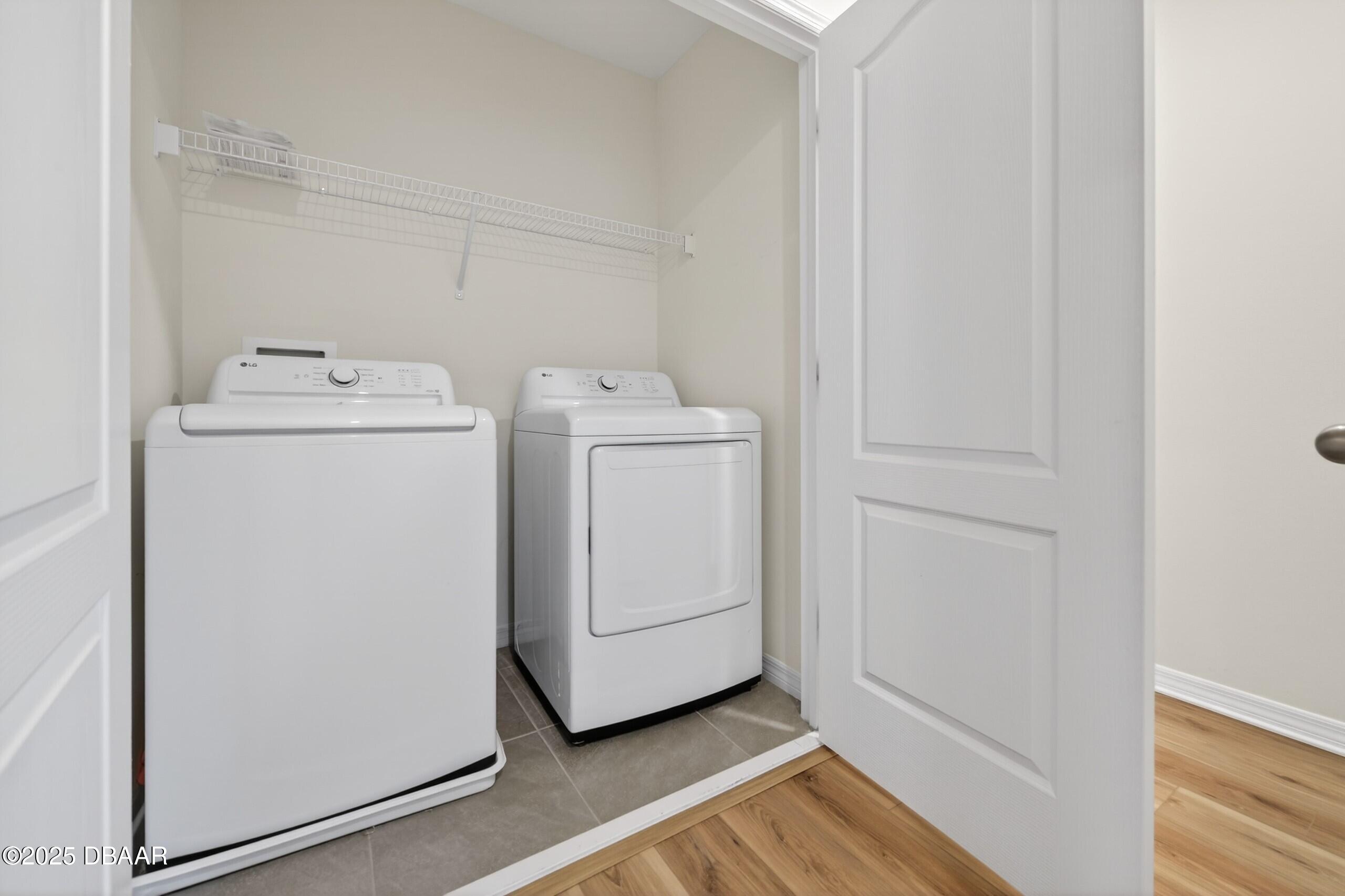 54 Bella Oaks Drive Port Orange, FL 32129 - Photo 15 of 32 a utility room with dryer and washer