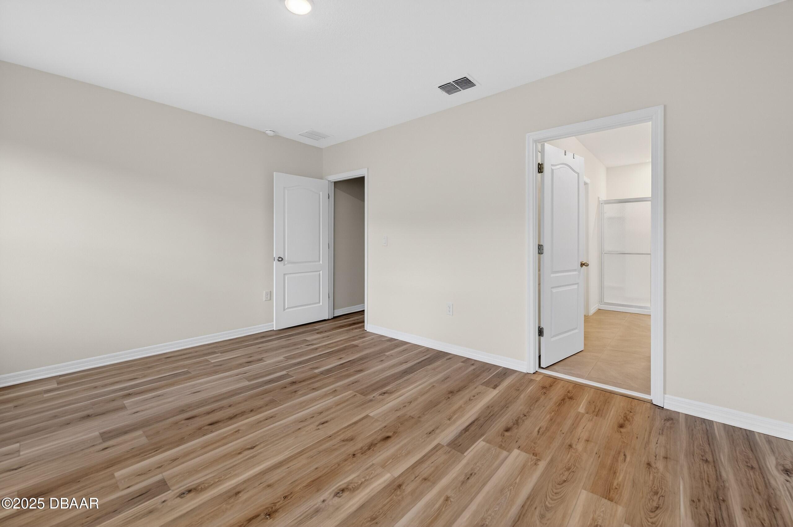 54 Bella Oaks Drive Port Orange, FL 32129 - Photo 17 of 32 a view of an empty room with wooden floor