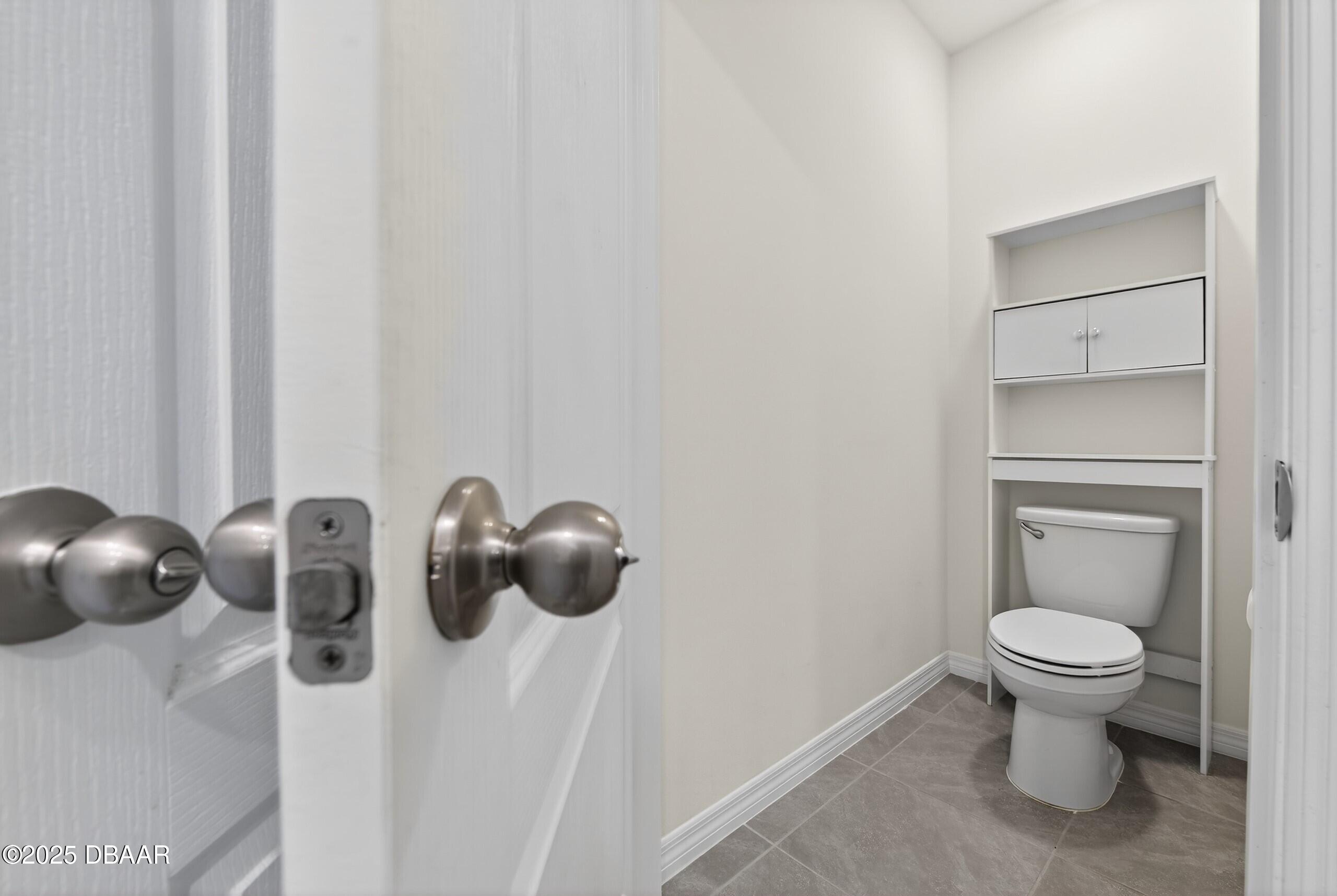 54 Bella Oaks Drive Port Orange, FL 32129 - Photo 19 of 32 a bathroom with a toilet and sink