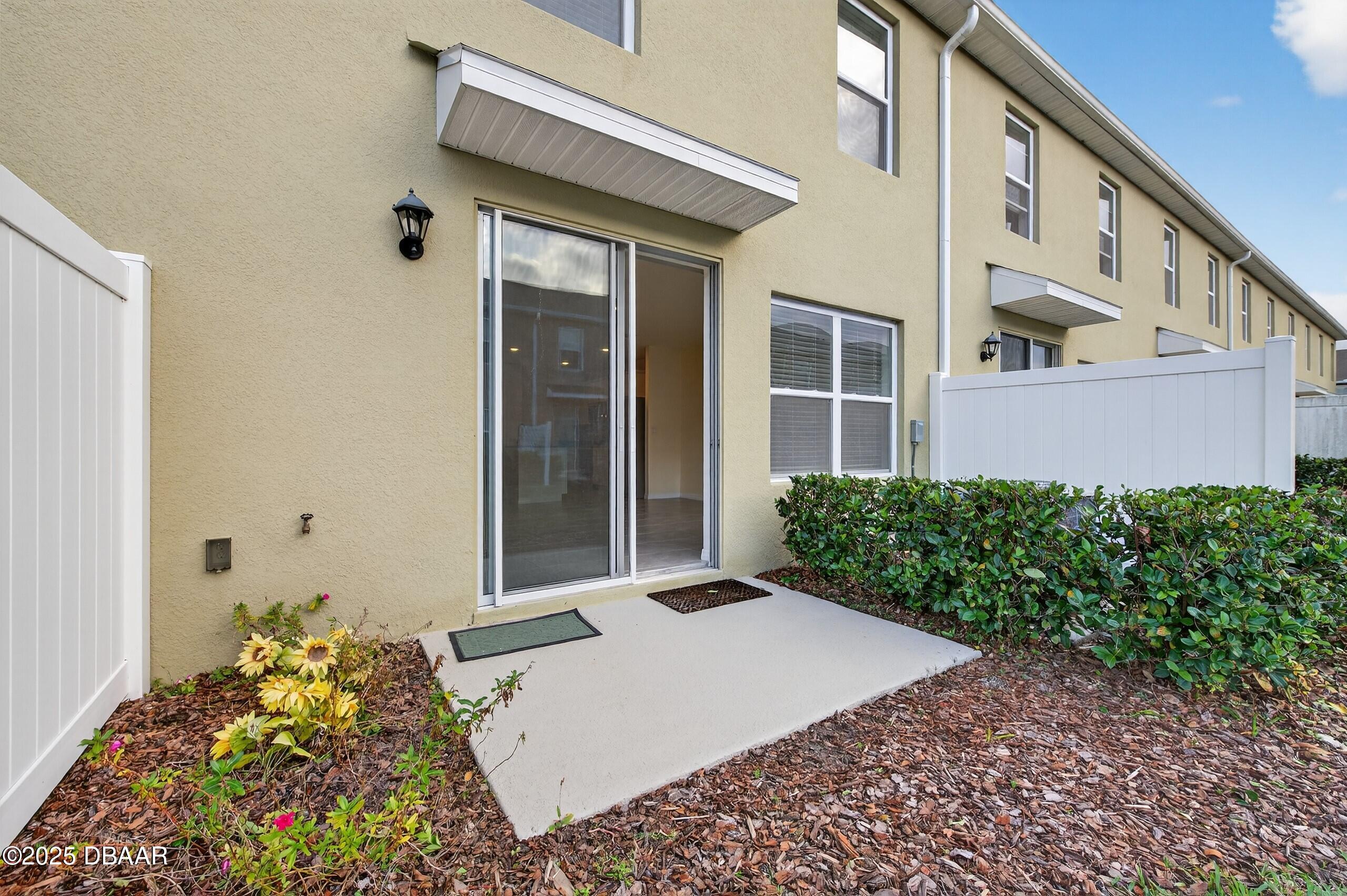 54 Bella Oaks Drive Port Orange, FL 32129 - Photo 23 of 32 a front view of a house with a yard
