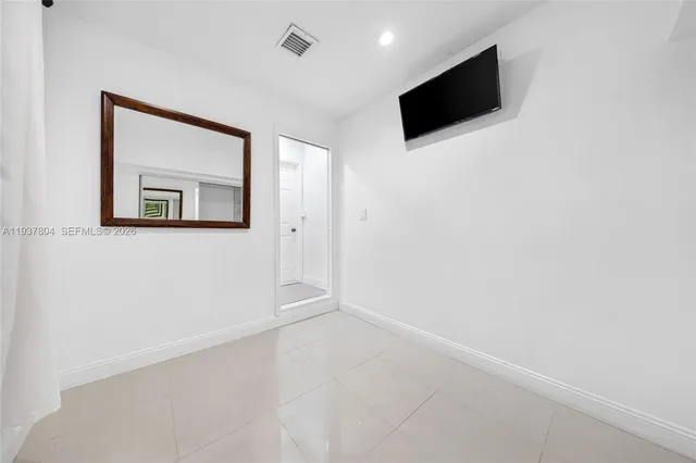 a view of a livingroom with wooden floor