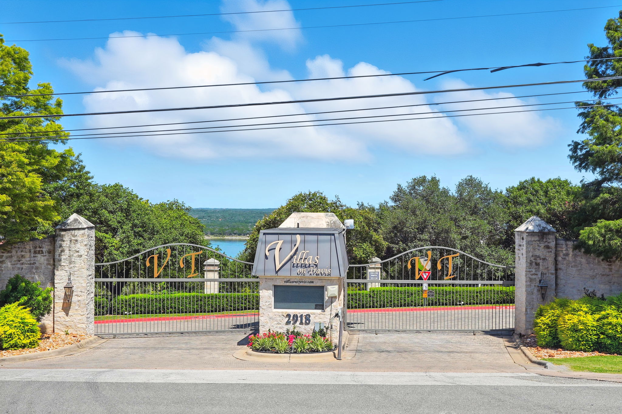 2918 Ranch Road 620 North, Unit C115 Austin, TX 78734 - Photo 38 of 39 View of street featuring curbs, a gate, and a gated entry