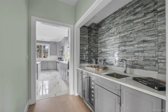 a kitchen with a sink and cabinets