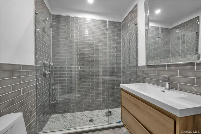 a bathroom with a shower and a sink