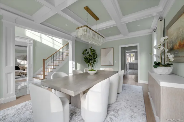 a dining room with table and chairs