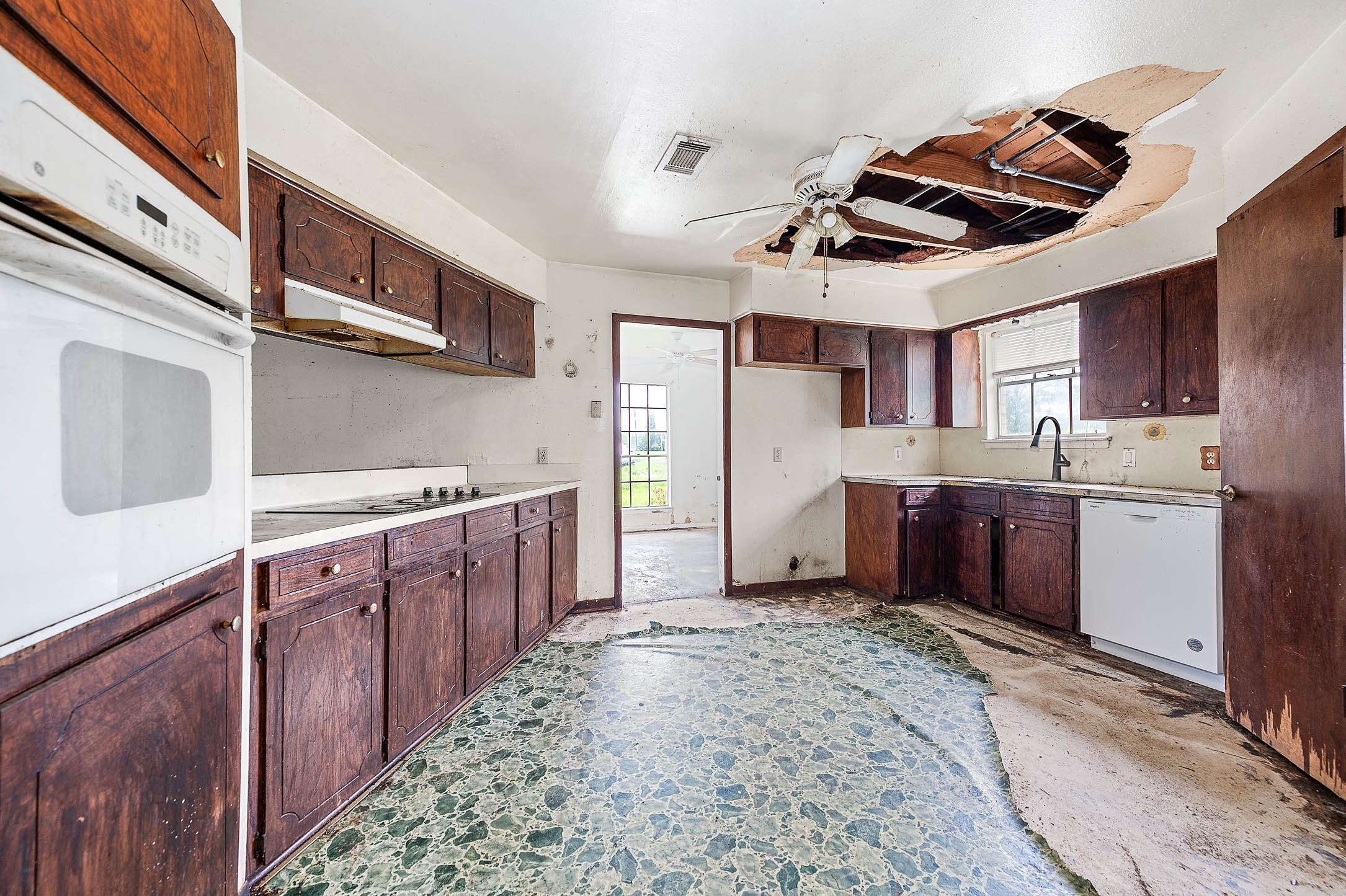 2719 Farm To Market 524 Road Sweeny, TX 77480 - Photo 9 of 20 a kitchen with stainless steel appliances granite countertop a sink and cabinets