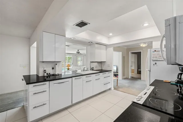 a spacious bedroom with a bed and a window