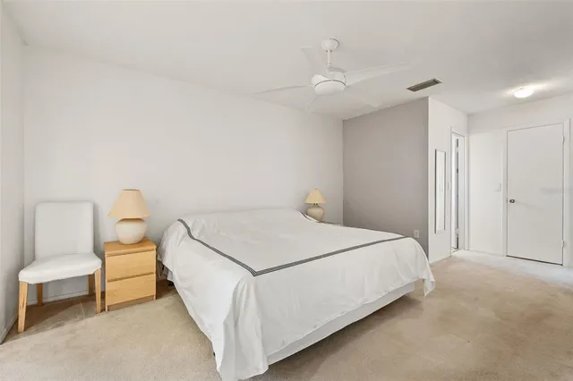 a large white bed in a white room