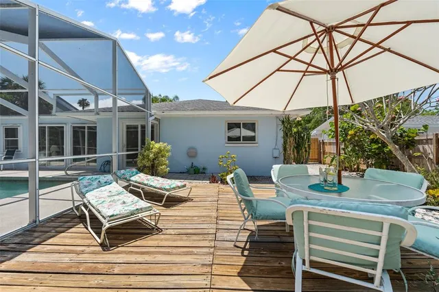 an aerial view of a house with a swimming pool