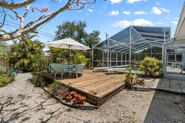 an aerial view of a house with a backyard